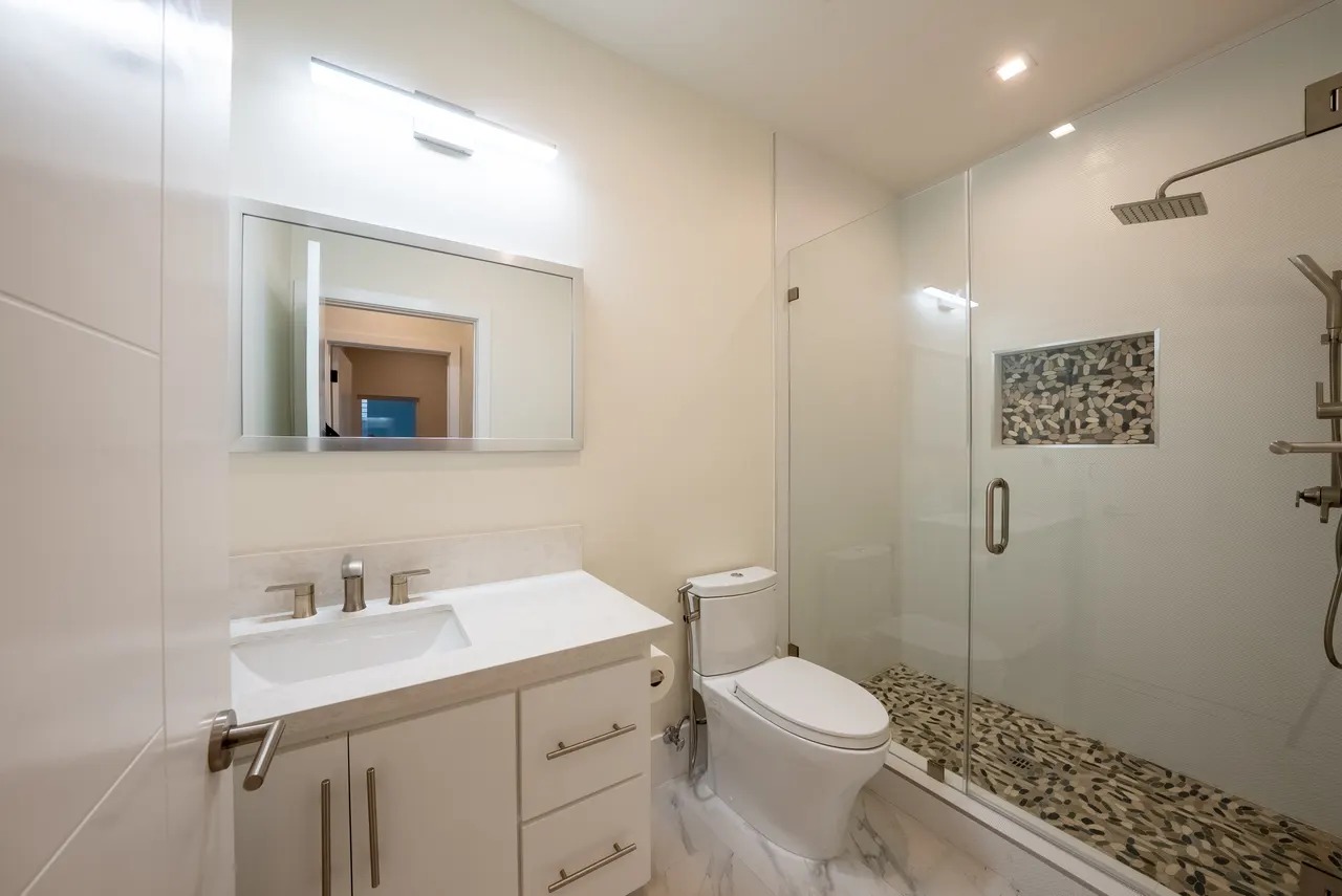 Bathroom with a floating vanity and glass walk-in shower