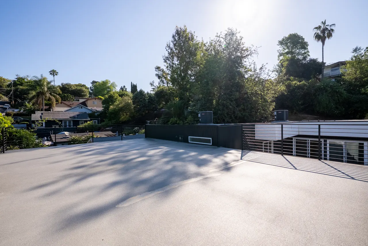 Rooftop deck and railing overlooking the hills