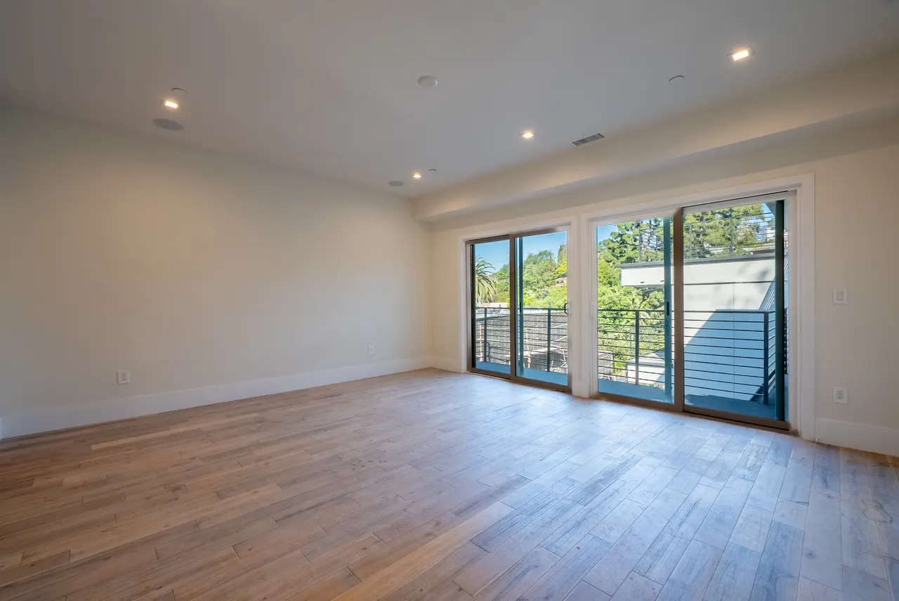 Great room opening to the deck through wide sliding glass doors