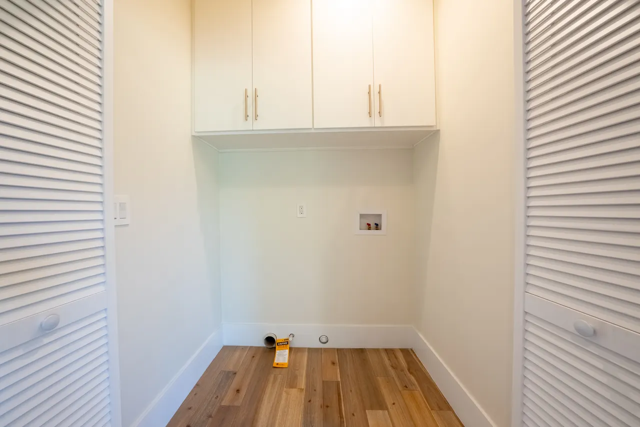 Laundry area with custom cabinetry